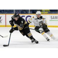 Charlottetown Islanders defenceman Lukas Cormier (left) vs. the Cape Breton Eagles