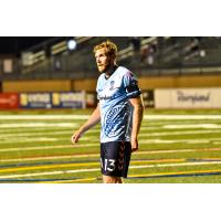 Forward Madison FC defender Connor Tobin