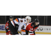 Binghamton Devils right wing Tyler Irvine (right) vs. the Lehigh Valley Phantoms