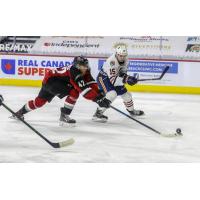 Vancouver Giants centre Justin Sourdif (left) vs. the Kamloops Blazers