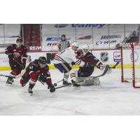 Vancouver Giants defenceman Alex Kannok Leipert tries to control a loose puck vs. the Kamloops Blazers