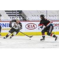 Vancouver Giants centre Tristen Nielsen (left) vs. the Kelowna Rockets