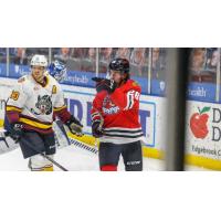 Rockford IceHogs forward Evan Barratt (right) vs. the Chicago Wolves