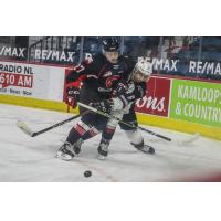 Riley Heidt of the Prince George Cougars delivers a blow vs. the Vancouver Giants