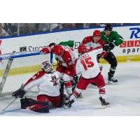 Allen Americans center Corey Mackin helps goaltender Justin Kapelmaster