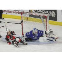 Prince George Cougars centre Ethan Browne meets the Victoria Royals goaltender