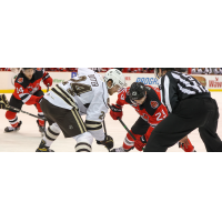 Binghamton Devils center Mason Jobst (right) faces off with the Hershey Bears