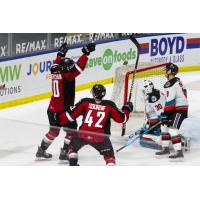 Vancouver Giants left wing Zack Ostapchuk (left) and centre Justin Sourdif react after a goal vs. the Kelowna Rockets