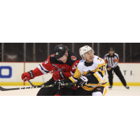 Binghamton Devils left wing Ben Thomson (left) vs. the Wilkes-Barre/Scranton Penguins