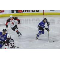 Prince George Cougars centre Riley Heidt (top left) vs. the Victoria Royals