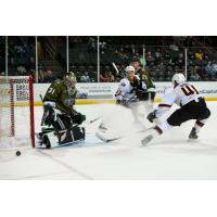 Tecas Stars goaltender Adam Scheel tips aside a shot by the Cleveland Monsters