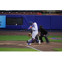 Jake Hager of the Syracuse Mets connects with a ball in the bottom of the fifth inning for a grand slam