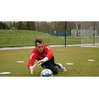 Forward Madison FC goalkeeper Aidan Hogan