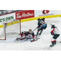 Prince George Cougars goaltender Taylor Gauthier stops a shot vs. the Kelowna Rockets