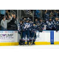 Jacksonville Icemen celebrate a goal in their Military Appreciation Weekend uniforms