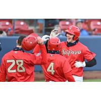 Spokane Indians exchange high fives at home plate