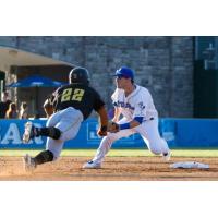 New YorkBoulders' Zach KIrtley awaits a throw to nail a sliding Martin Figueroa of the Sussex County Miners