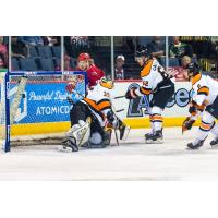 Corey Mackin of the Allen Americans (back) tucks in a goal against the Fort Wayne Komets