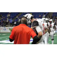 Jacksonville Sharks quarterback Connor Kaegi talks with coach James Fuller