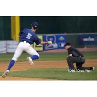 New York Boulders shortstop Phil Caulfield makes an off-balance throw to complete a second inning force play