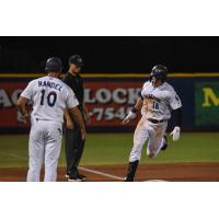 Griffin Conine of the Pensacola Blue Wahoos rounds the bases following his home run