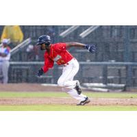Diego Hernandez of the Columbia Fireflies runs in the rain