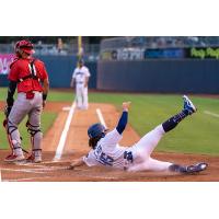 James Outman slides safely into home on one of his two runs scored during the Tulsa Drillers 15-2 win