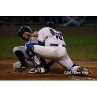 Tri-City's Zach Biermann slides safely into home plate under tag of New York Bouders' Phil Capra in third inning