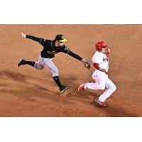 Eugene Emeralds chase a Spokane Indians baserunner