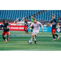Forward Madison FC defender Connor Tobin with possession against New England Revolution II