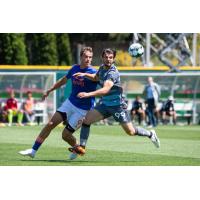 Tacoma Defiance midfielder Tom Brewitt (right)