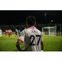 Forward Madison FC defender Christian Diaz observes the action