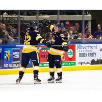 Erie Otters exchange fist bumps following a goal