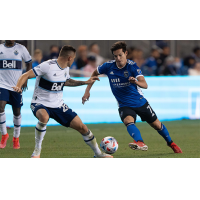 San Jose Earthquakes forward Carlos Fierro (right) vs. Vancouver Whitecaps FC