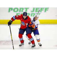 Springfield Thunderbirds left wing Nolan Stevens (left) takes on the Bridgeport Islanders