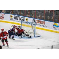 Rapid City Rush goaltender David Tendeck turns aside a Tulsa Oilers shot