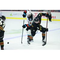Vancouver Giants centre Ty Thorpe (right) vs. the Kelowna Rockets