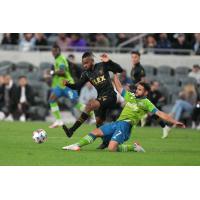 Seattle Sounders FC midfielder Cristian Roldan slides to make a tackle at LAFC