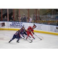 Rapid City Rush center Hudson Elynuik (right) vs. the Tulsa Oilers