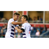 Antoine Hoppenot (right) receives congratulations after scoring the winning goal for Louisville City FC