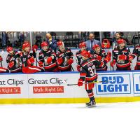 Tyler Spezia receives congratulations along the Grand Rapids Griffins bench