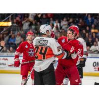 Allen Americans defenseman Jay Jerome (right) exchanges greetings with the Kansas City Mavericks