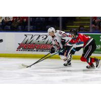Kelowna Rockets defenceman Elias Carmichael (right) in chase against the Kamloops Blazers