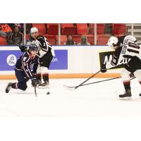Vancouver Giants left wing Zack Ostapchuk (right) vs. the Tri-City Americans