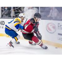 Red Deer Rebels defenceman Christoffer Sedoff (right) vs. the Saskatoon Blades