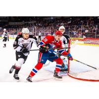 Vancouver Giants defenceman Tanner Brown (left) vs. the Spokane Chiefs
