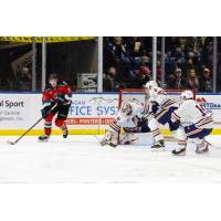 Kelowna Rockets right wing Jake Poole (left) vs. the Kamloops Blazers