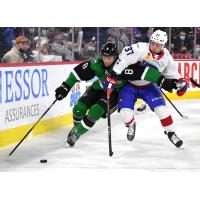 Texas Stars defenseman Thomas Harley (left) vs. the Laval Rocket