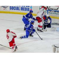 Gavin Gould of the Allen Americans (lower left) shoots through traffic against the Wichita Thunder
