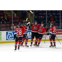Kelowna Rockets gather after a goal
